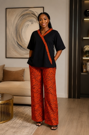 Ankara revolution 394 Women’s Two Piece Palazzo Set Black Trim Top and Orange Wave Wide Leg Trousers - Image 1